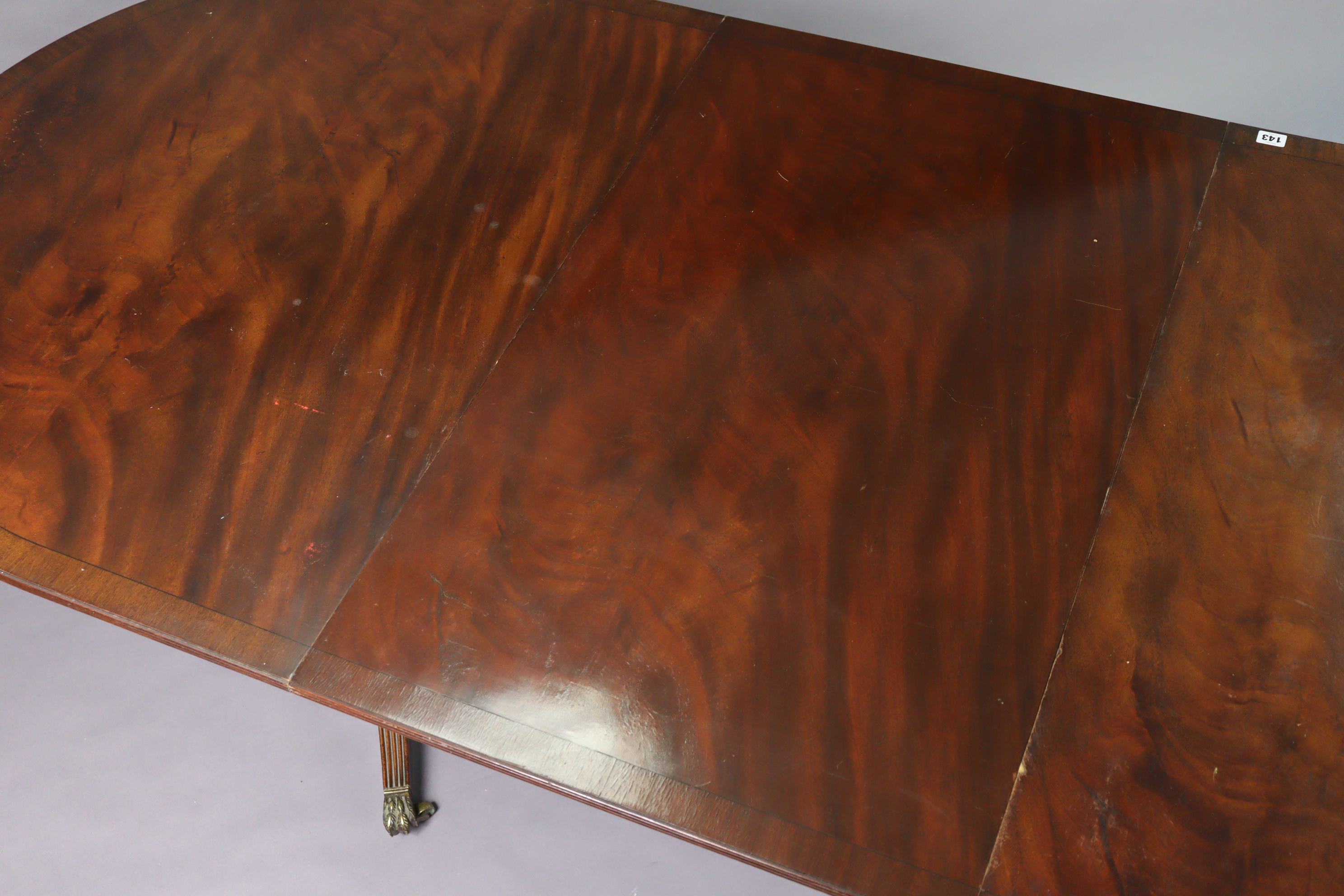 A regency-style inlaid-mahogany twin-pedestal tilt top extending dining table with d-shaped ends, - Image 3 of 9