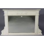 A late 19th/early 20th century white painted wooden frame overmantel mirror with raised griffin &