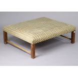 A large rectangular footstool with a padded seat upholstered multi-coloured chequered material, & on