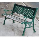 A green painted cast-iron & wooden slated garden bench, 50” long.