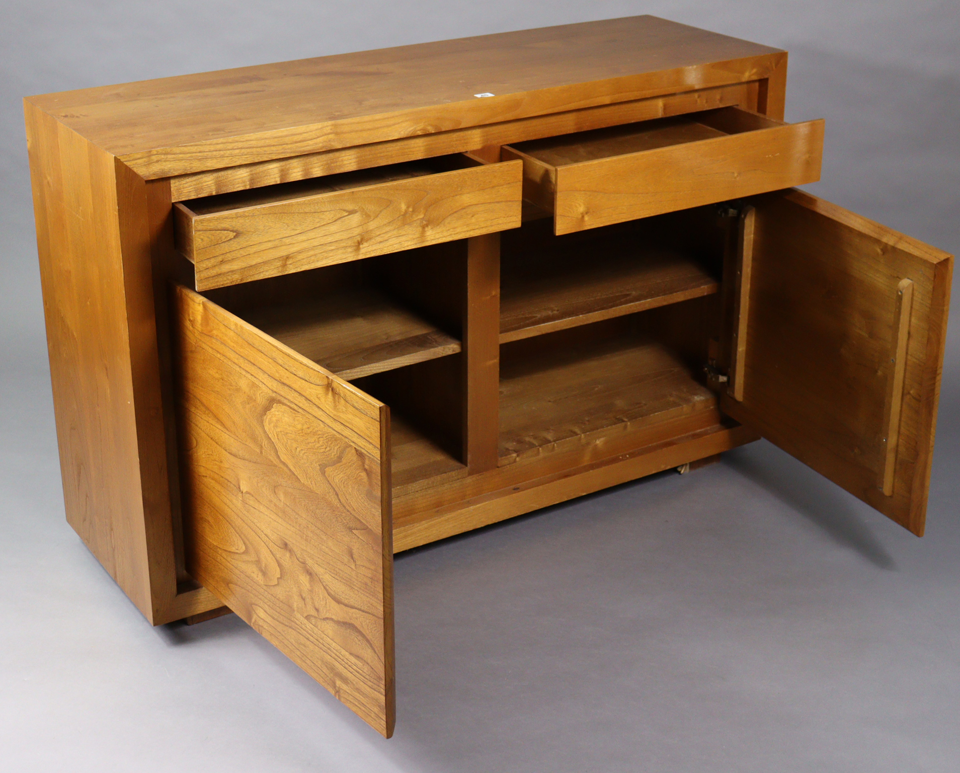 A teak sideboard fitted two frieze drawers above cupboard enclosed by a pair of panel doors, 55½” - Image 2 of 4