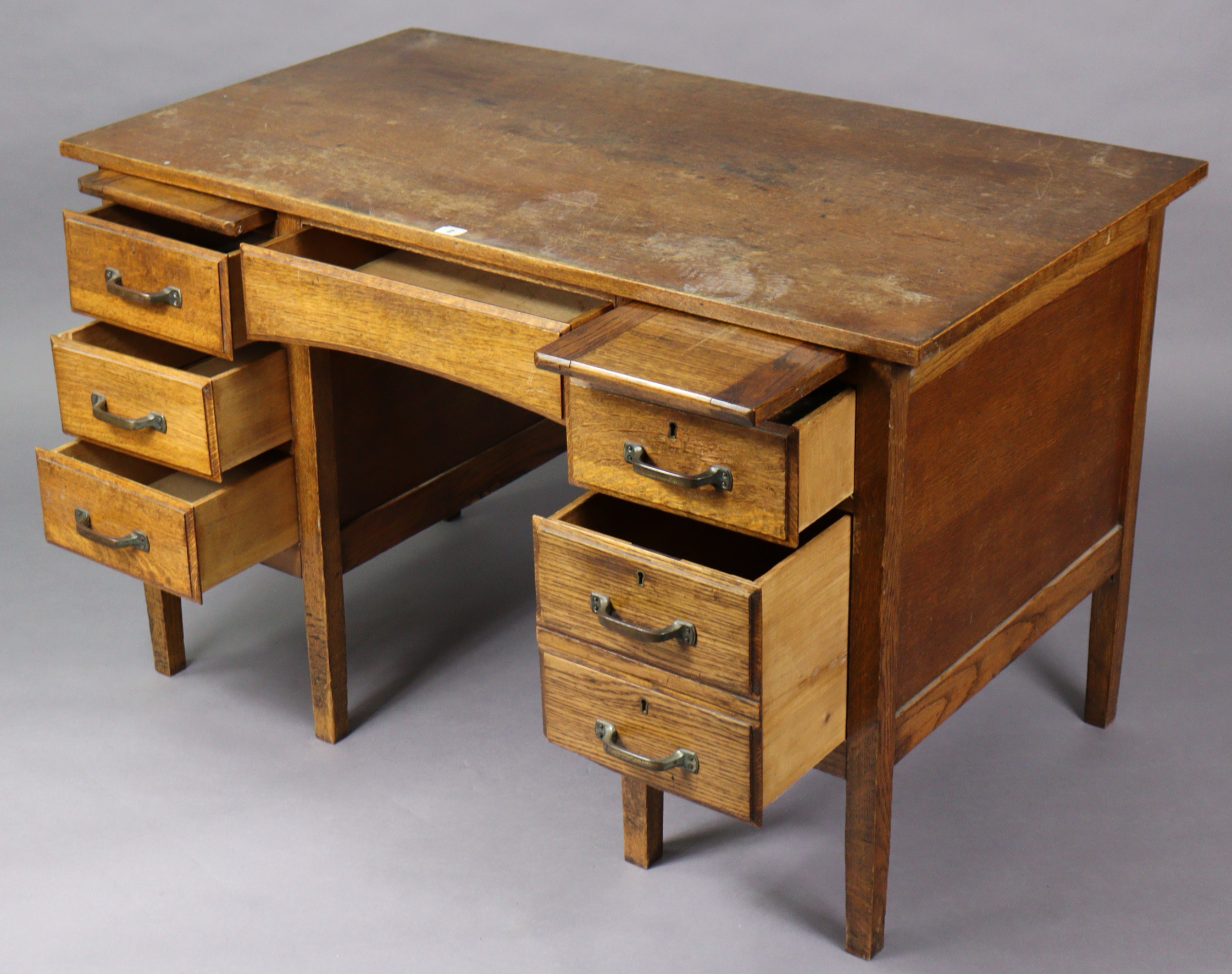 A mid-20th century oak knee-hole office desk fitted with two brushing slides above an arrangement of - Image 2 of 5