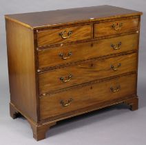 A Georgian mahogany chest fitted two short & three long graduated drawers with brass swing