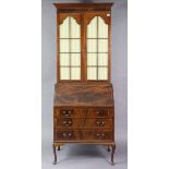 An Edwardian inlaid-mahogany bureau-bookcase, the upper part fitted three shelves enclosed by pair