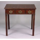 A Georgian mahogany side table with moulded edge to the rectangular top, fitted three frieze drawers