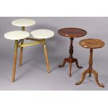 A contemporary occasional table with three white marble tops, & on three round legs; together with