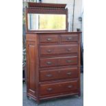 A late 19th/early 20th century walnut upright dressing chest with a rectangular mirror to the