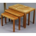 A 1960s Danish Vejle Stole Møbelfabrik teak nest of three rectangular tables, each on four square le