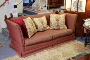 A Knowle-style three-seater drop-end settee upholstered crimson material 80” long.