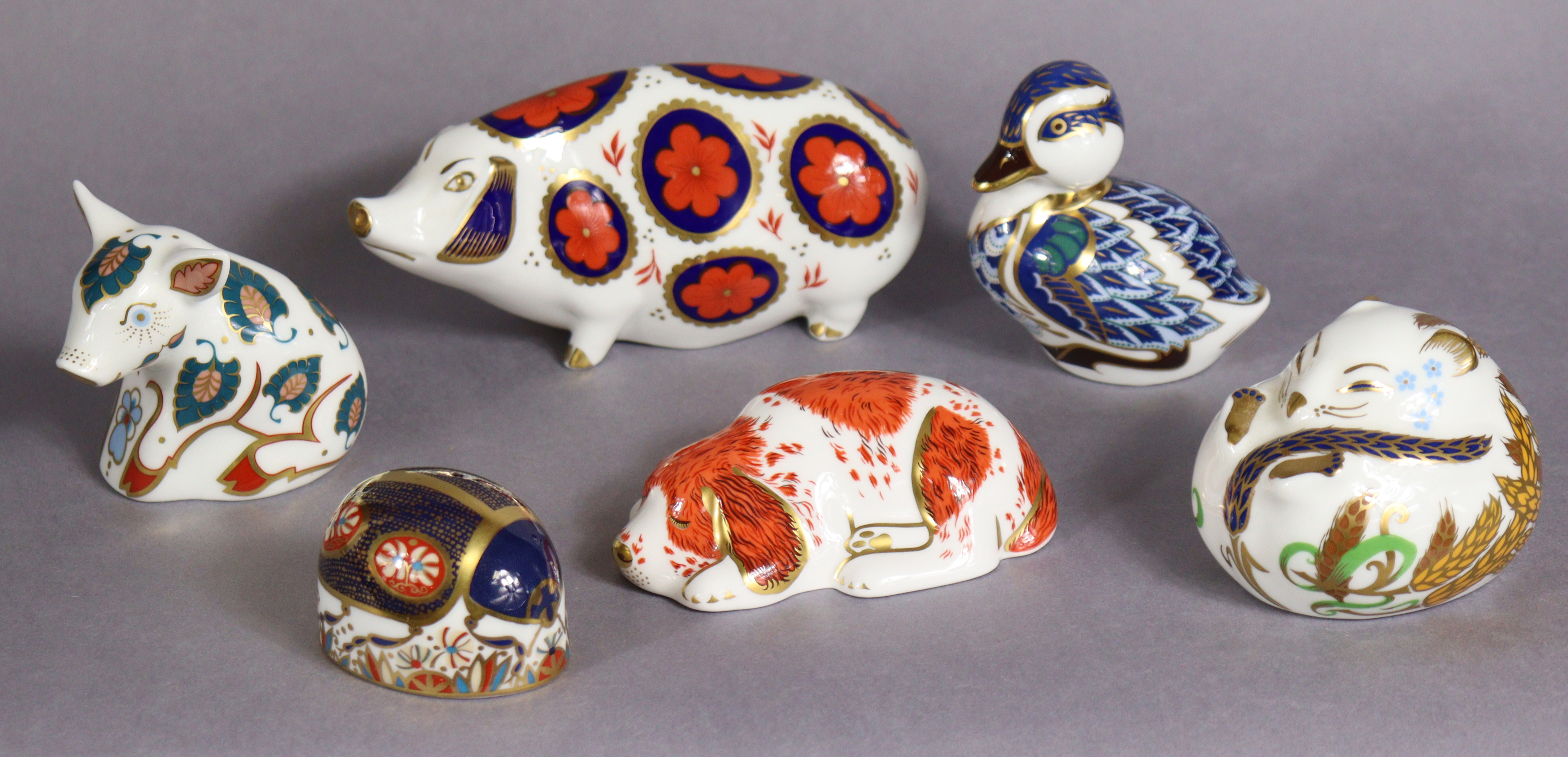 Six Royal Crown Derby porcelain paperweights: Pig; Sleeping Dormouse; Duckling; Blue Ladybird; Snuff