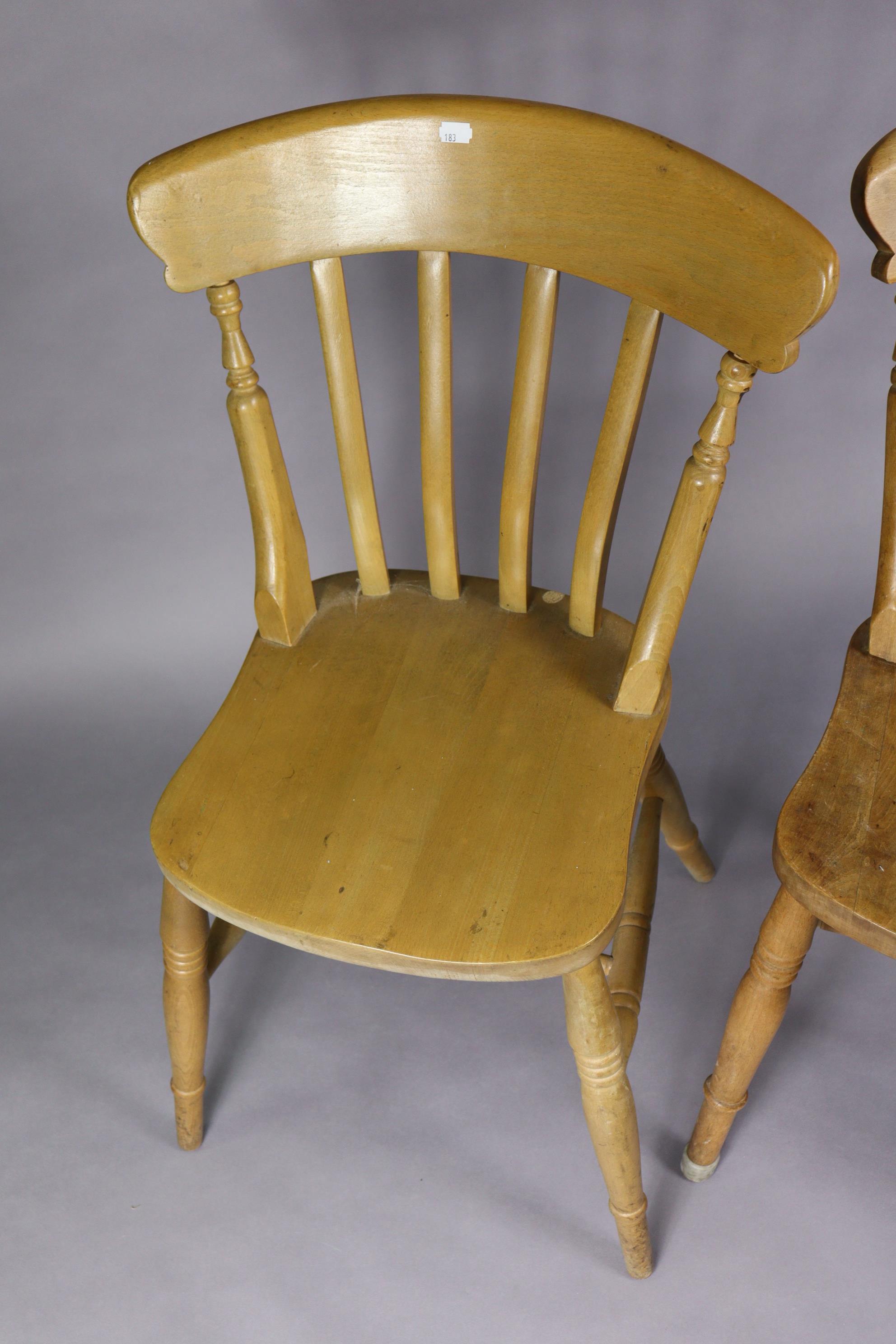 A pair of lath-back kitchen chairs with hard seats, and on ring-turned legs with turned stretchers. - Image 3 of 4