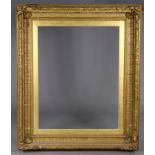 A large antique giltwood & gesso picture frame, 50” x 42” over-all.