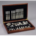 A mahogany canteen containing forty-five items of king’s pattern flatware & cutlery