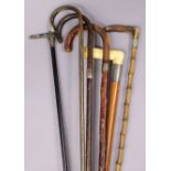 Six various vintage walking canes, each with silver mount.