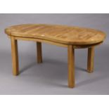 A Cotswold collection teak low coffee table with a kidney-shaped top, & on four square legs, 48½”