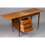 A BMP teak knee-hole desk fitted three long drawers and with a drop-end to the left-hand side, and