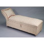 A mid-20th century daybed with a scroll end & hinged box seat upholstered multi-coloured geometric