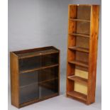 An oak tray-top bookcase enclosed by two pairs of glass sliding doors, 36” wide & 36” high; a pine