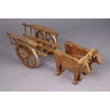 A wooden model of a bullock-drawn cart, 29” long.
