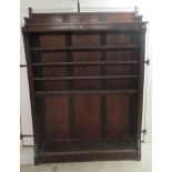 An Edwardian mahogany open front bookcase with four height adjustable shelves, on a plinth  66"h