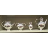A late Victorian Martin Hall & Co silver plated four piece tea set, in the manner of Christopher
