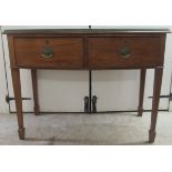 An early 20thC mahogany bow front, two drawer sideboard, raised on square, tapered legs and spade