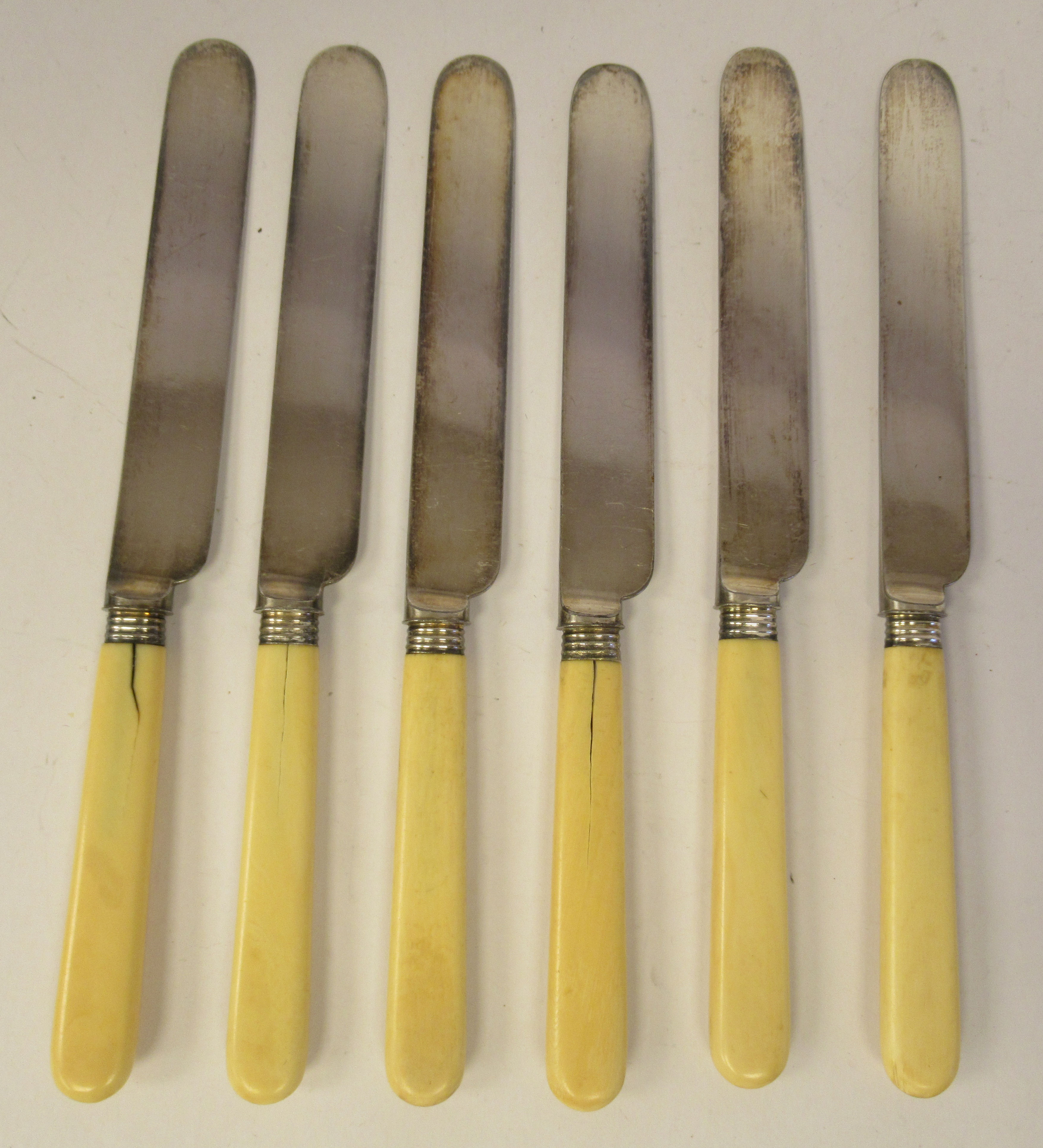 A set of six late 19thC silver plated fruit knives, on ivory handles