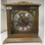 A late 20thC American Bulova mahogany cased bracket clock, the top with a folding handle, over a