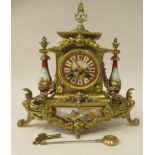 A late 19thC French Brunfaut gilt metal and painted porcelain cased mantel clock with pillared