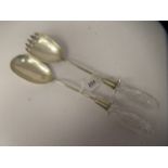 A pair of late Victorian silver salad servers with cut glass handles  Chester 1886