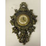 A 20thC gilded cast metal Cartel timepiece, ornamented with flora and sculls; the movement faced