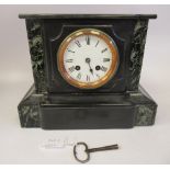 A late Victorian black slate and mottled green marble cased, platform top mantel clock; the bell