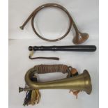 A military style brass bugle with a tasselled cord; a huntsman's coiled copper and brass horn; and a