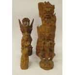 Four 20thC Balinese hardwood carvings, figures and mythical beasts  largest 13"h