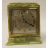 A mid 20thC Elliot Clock, the mottled green alabaster case with a level top and square, lacquered