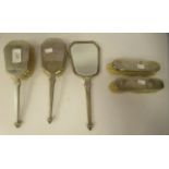 A matched set of five silver backed dressing table items  mixed marks