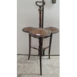 An Edwardian mahogany three tier cake stand, raised on splayed legs  37"h