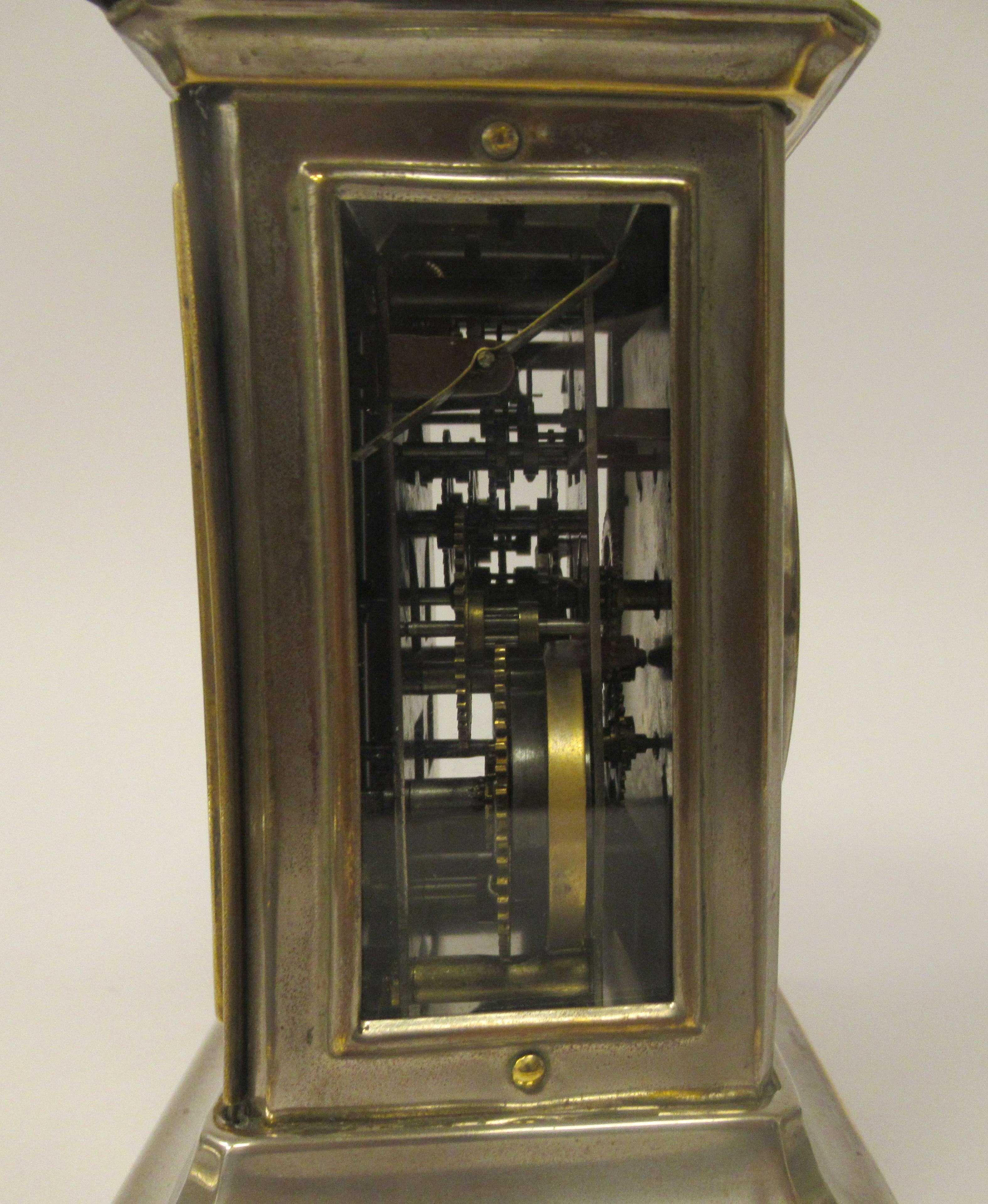 An early 20thC electroplated and brass inlaid mantel clock with a glazed panel and a folding top - Image 5 of 6