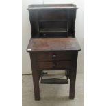 An early/mid 19thC mahogany book press station with a manually operated pedal and two front facing