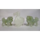 Three Chinese jade coloured ornaments, viz. a pair of Dogs of Fo  2"h; and a bird  3"h