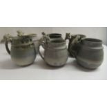 A set of six 1980s studio pottery mugs, each handle surmounted by a stylised creature  bears an