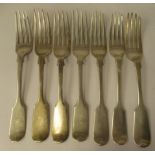 A matched set of seven 19thC silver fiddle pattern table forks  mixed marks