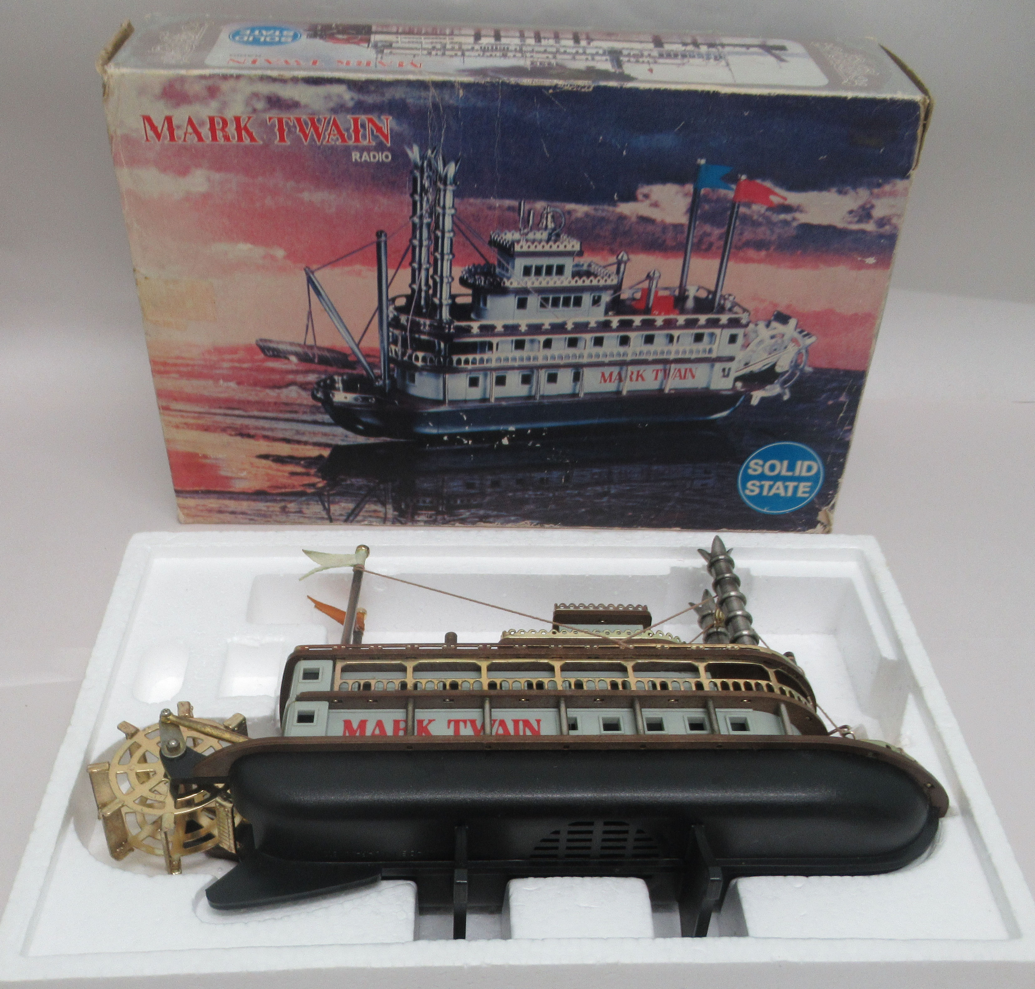 A 1960s Mark Twain novelty solid state radio, fashioned as a Mississippi paddle steamer, in the