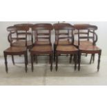 A set of eight Regency mahogany framed bar back dining chairs, the solid seats raised on turned,