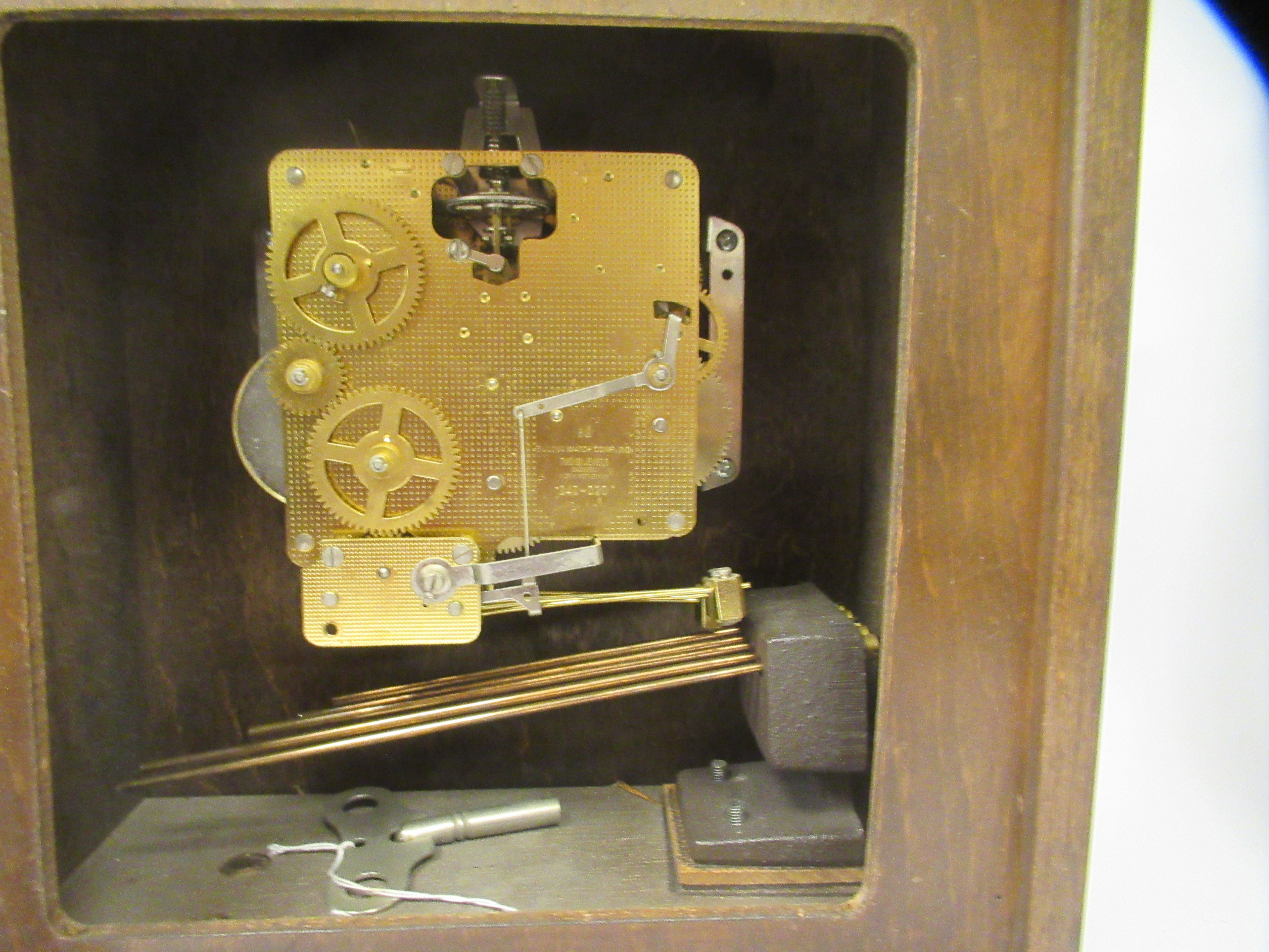 A late 20thC American Bulova mahogany cased bracket clock, the top with a folding handle, over a - Image 7 of 9