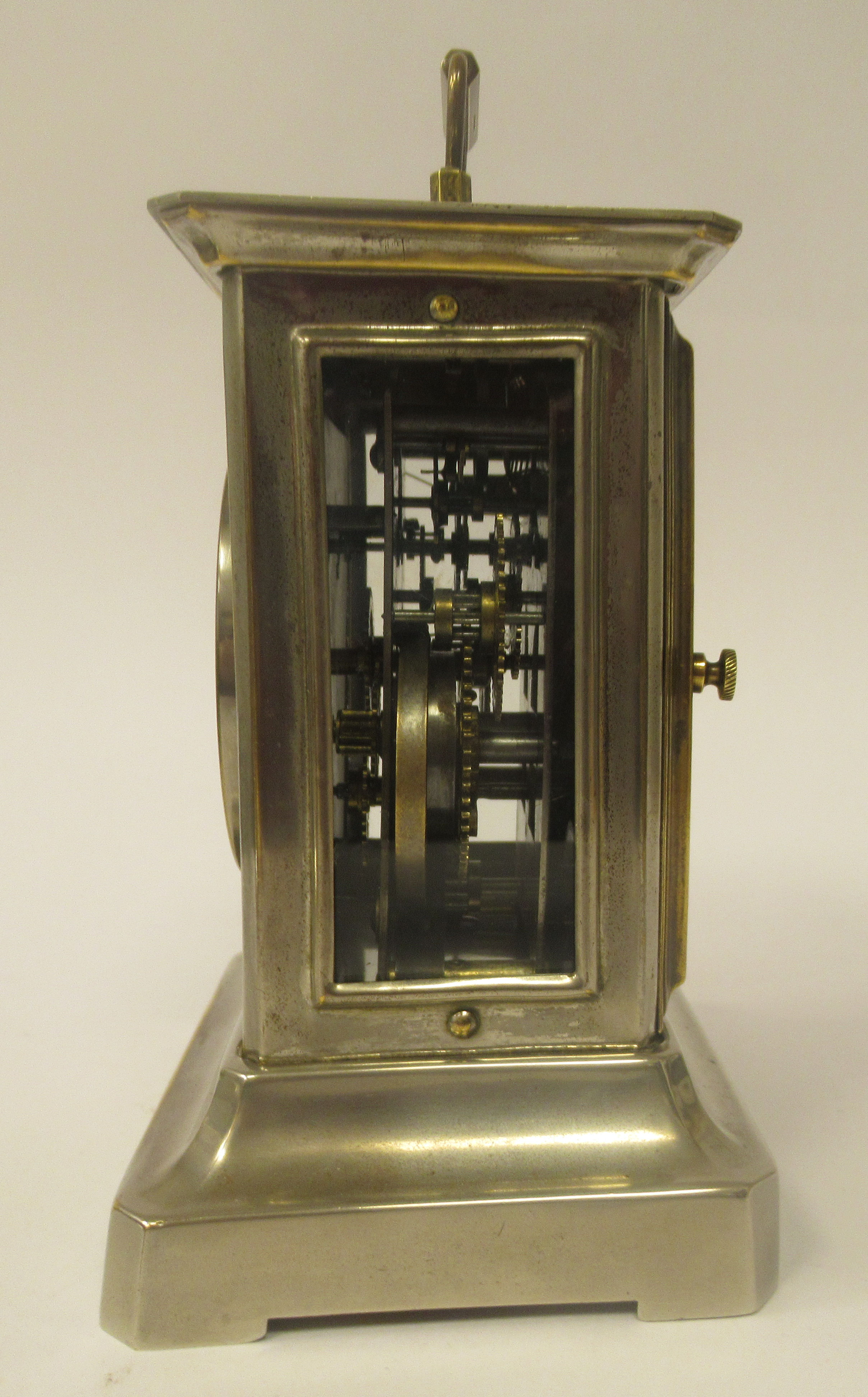 An early 20thC electroplated and brass inlaid mantel clock with a glazed panel and a folding top - Image 2 of 6