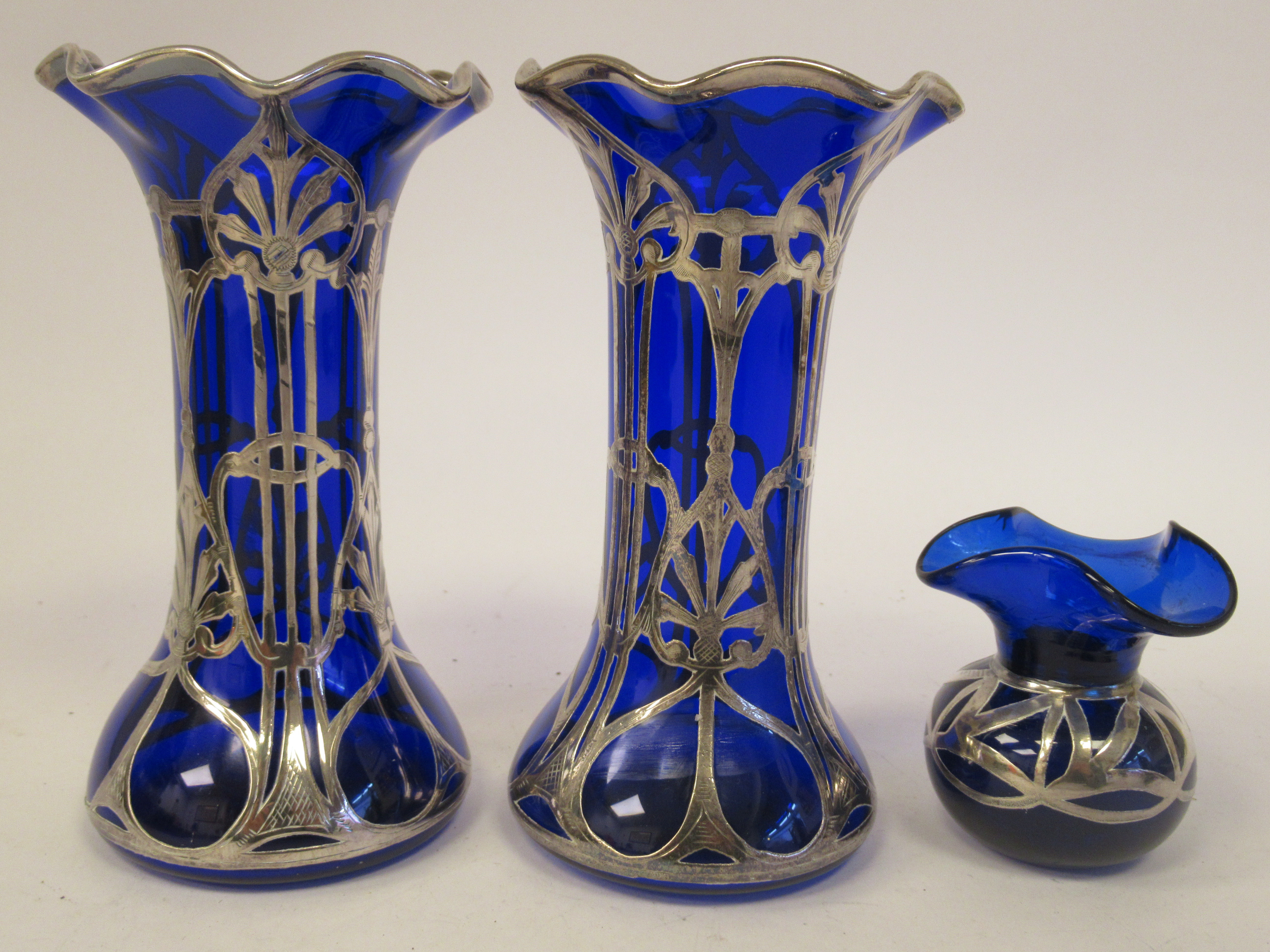 A pair of early 20thC blue glass vases of waisted and part bulbous cylindrical form, having