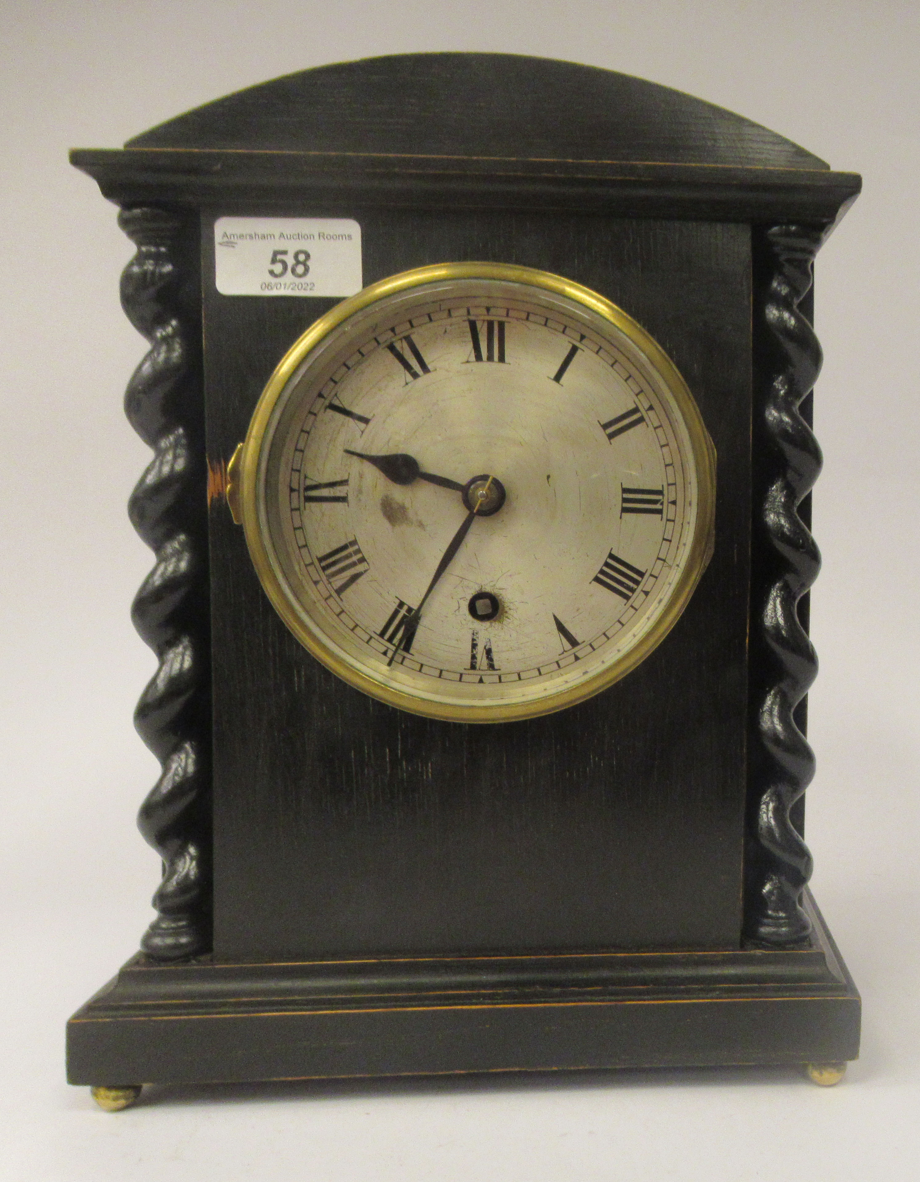 A late 19th/early 20thC stained oak cased, round arched mantel timepiece; the 8 day Astral