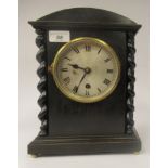 A late 19th/early 20thC stained oak cased, round arched mantel timepiece; the 8 day Astral