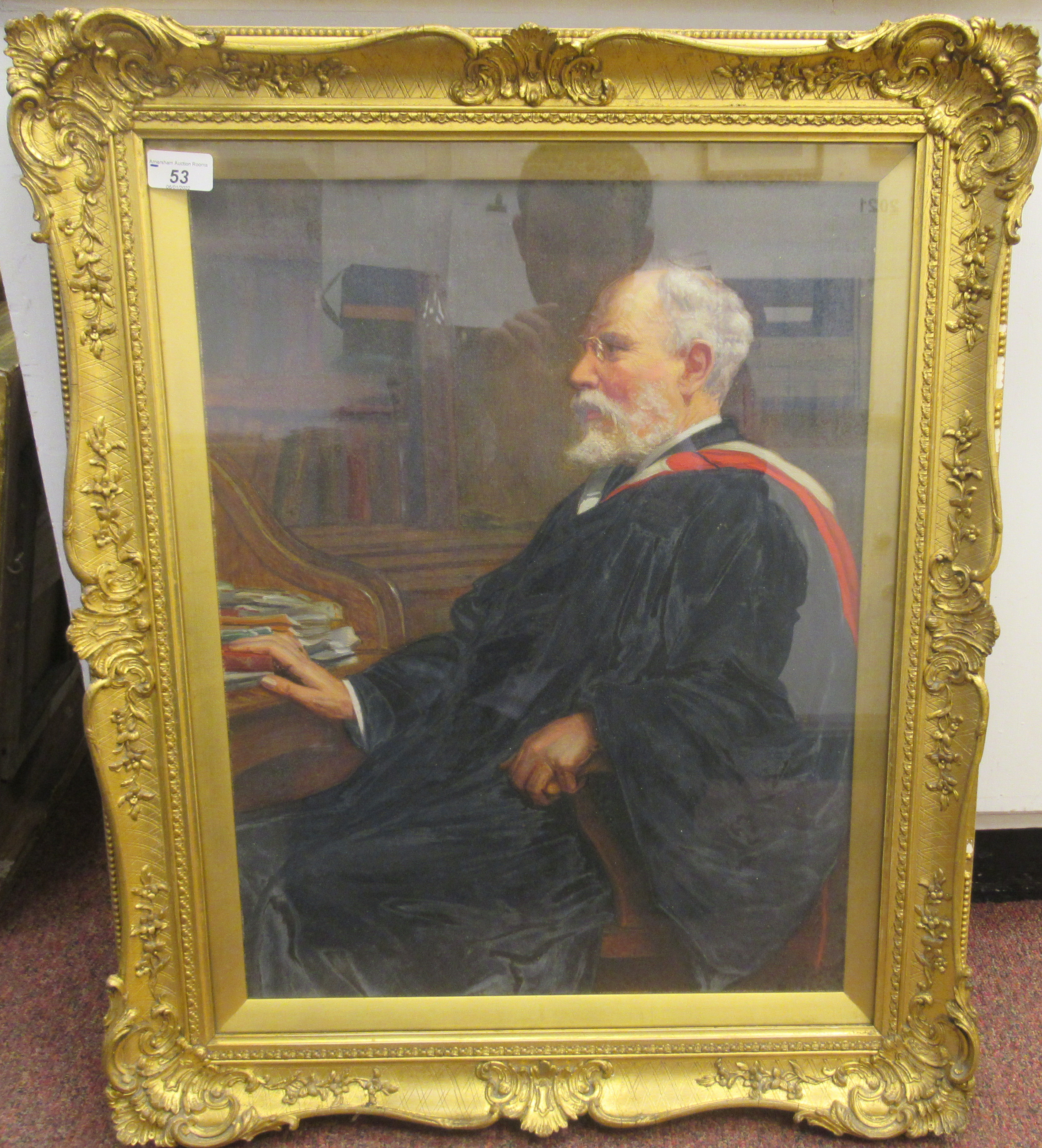 CE Butler - a schoolmaster wearing his academics gown, seated at a desk  oil on canvas  bears a